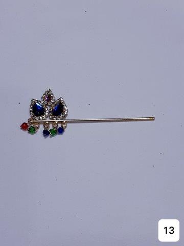GOLDEN 3" BANSURI WITH BLUE AND RED BIG STONES AND DECORETED WITH TINY STONES.