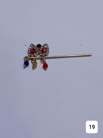 GOLDEN 2'' BANSURI TWO BIG STONES AND MULTI COLORED STONES.